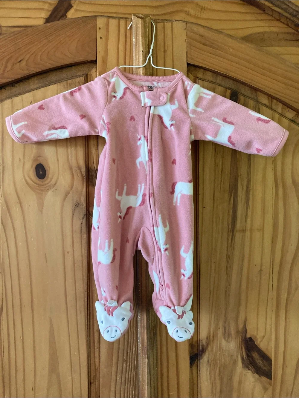 Girls Carter’s pink unicorn footed pajamas size newborn